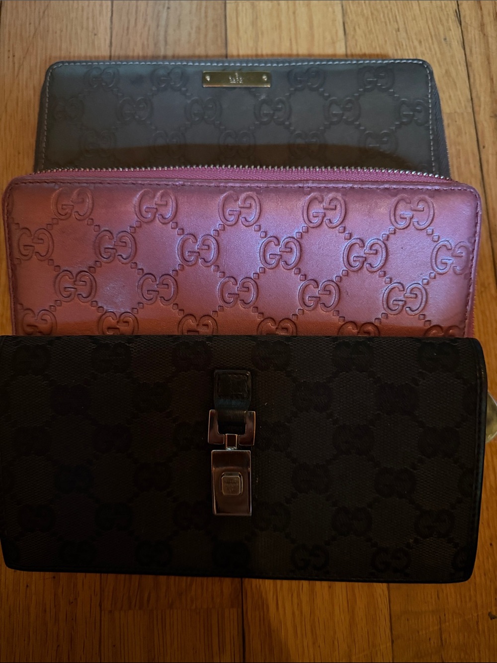 Gucci Black, Brown, and Pink Signature Wallet Trio
